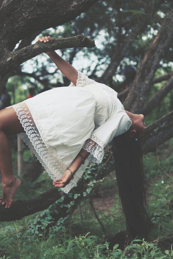 boho woman in dark woods